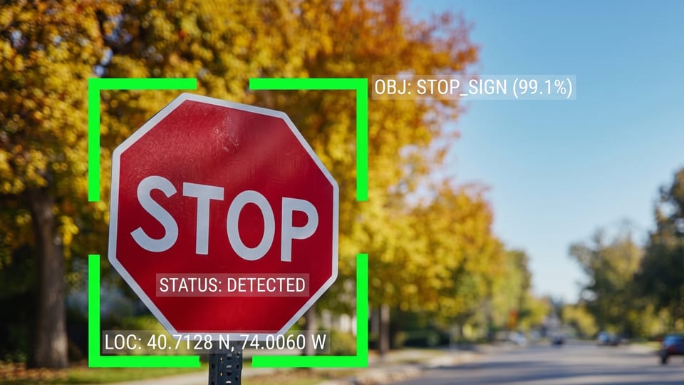 A stop sign detected and outlined in a camera frame